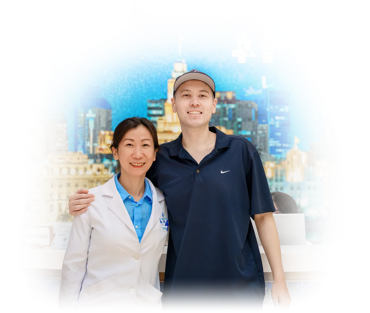 Dr. Lily Zhou, in a white coat, with a patient in front of the Shanghai skyline mural at SinoUnited Health.